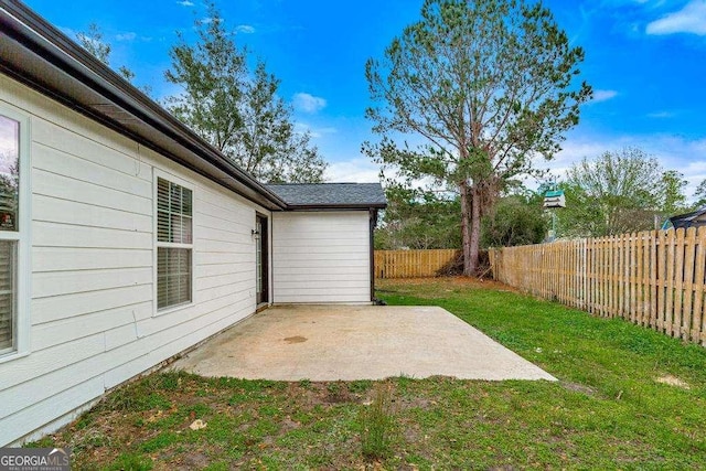 view of yard featuring a patio and a fenced backyard