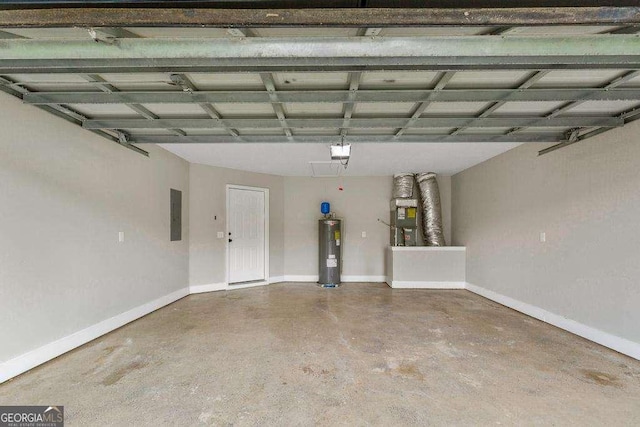 garage with electric panel, a garage door opener, baseboards, and electric water heater