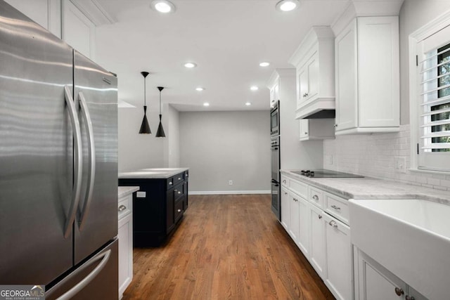 kitchen featuring decorative backsplash, recessed lighting, appliances with stainless steel finishes, dark wood-style floors, and white cabinets