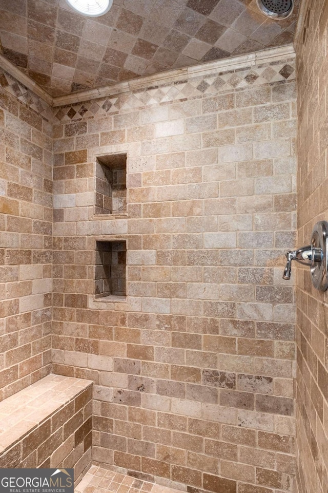 full bathroom featuring tiled shower