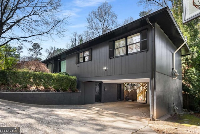 view of front of property with a carport and driveway