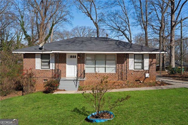 single story home with a front yard, brick siding, and crawl space