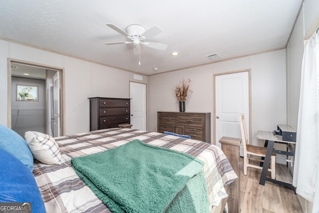 4159 Folks Dr, Blackshear, GA 31516 - bedroom with ceiling fan, visible vents, light wood-type flooring, and ornamental molding