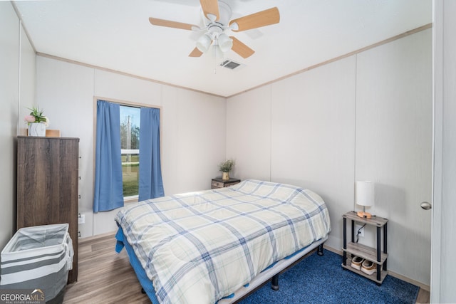 4159 Folks Dr, Blackshear, GA 31516 - bedroom with ceiling fan, visible vents, wood finished floors, and crown molding
