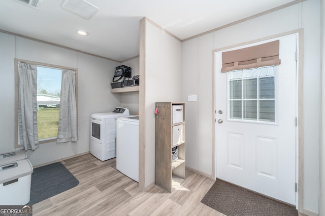 4159 Folks Dr, Blackshear, GA 31516 - laundry room featuring laundry area, separate washer and dryer, light wood-style floors, and ornamental molding