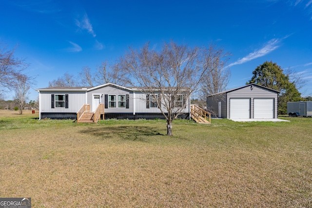 4159 Folks Dr, Blackshear, GA 31516 - manufactured / mobile home featuring a garage, an outbuilding, and a front yard