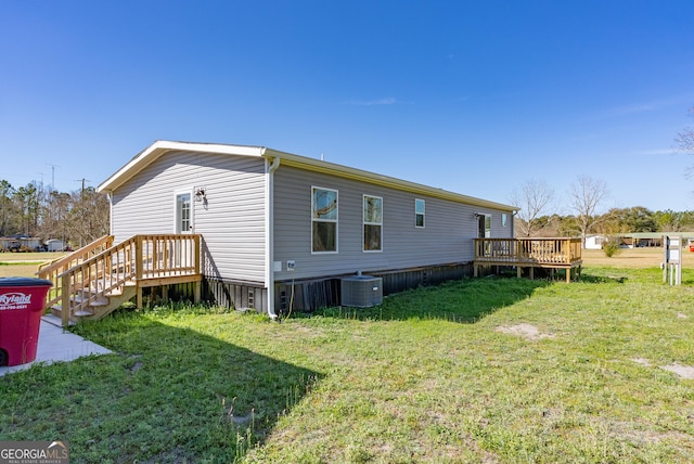 4159 Folks Dr, Blackshear, GA 31516 - view of side of property featuring a yard, central AC unit, and a deck