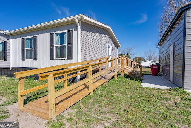 4159 Folks Dr, Blackshear, GA 31516 - view of side of property with stairway, a lawn, a patio, and a deck