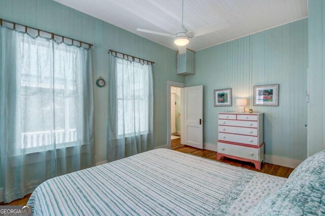 bedroom with ceiling fan and wood finished floors