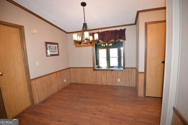 160 Cold Branch Rd, Eatonton, GA 31024 - unfurnished dining area with crown molding, a chandelier, vaulted ceiling, a textured ceiling, and wood finished floors