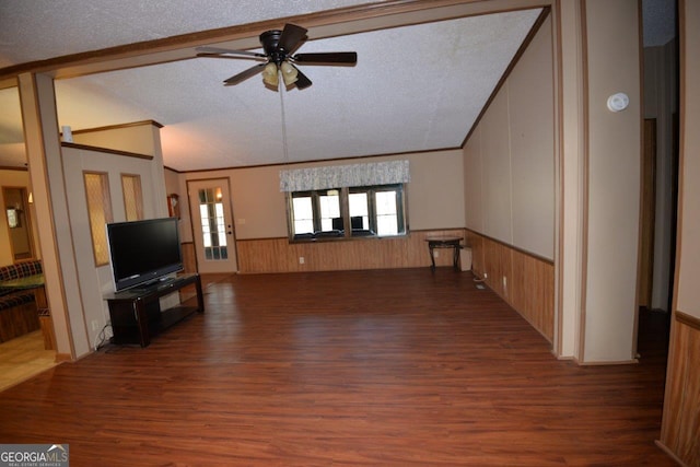160 Cold Branch Rd, Eatonton, GA 31024 - unfurnished living room with vaulted ceiling, wood finished floors, ceiling fan, a textured ceiling, and a wainscoted wall