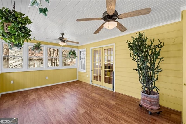 unfurnished sunroom with french doors