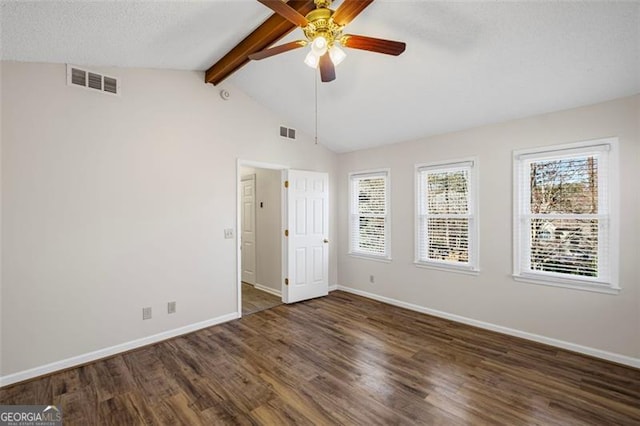 unfurnished room with visible vents, lofted ceiling with beams, baseboards, and wood finished floors