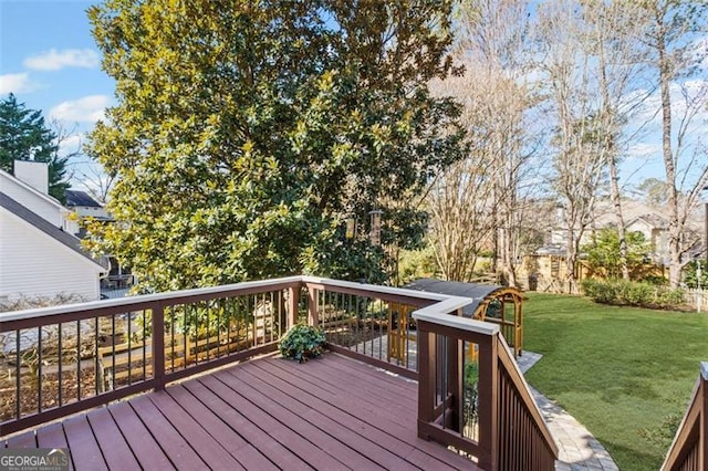 deck featuring a lawn