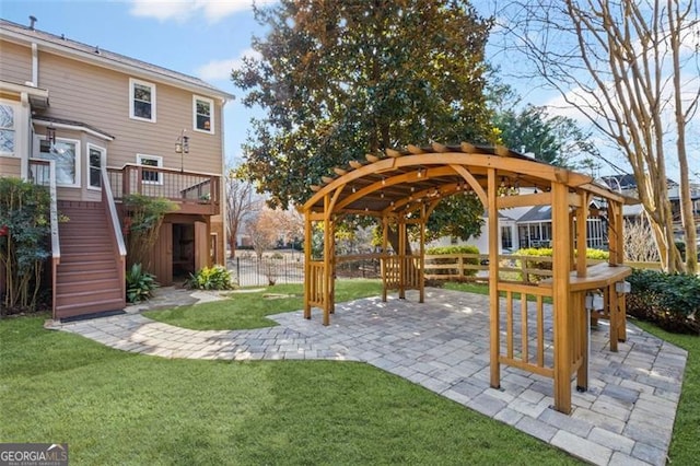 view of yard with a patio, fence, stairs, and a pergola