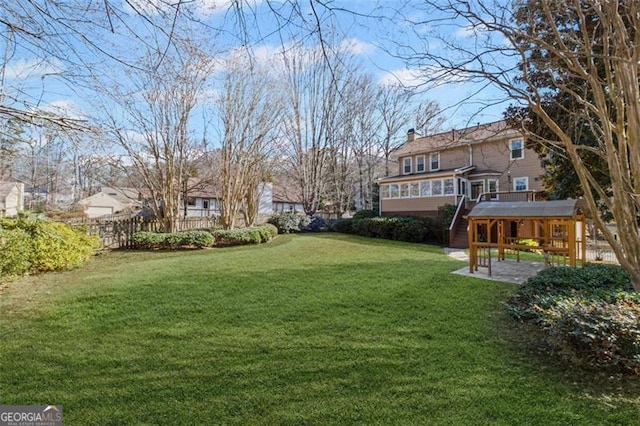 view of yard featuring a patio area and fence