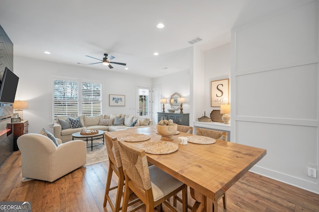 dining area featuring visible vents, recessed lighting, and wood-type flooring