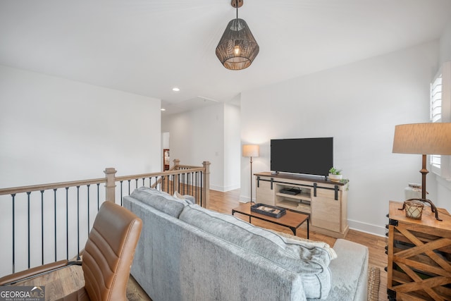 living room with recessed lighting, wood finished floors, and baseboards