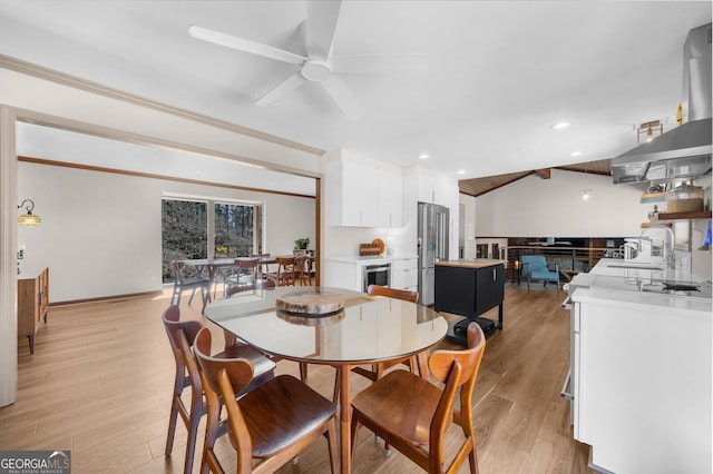 dining space with beverage cooler, a ceiling fan, recessed lighting, light wood-style floors, and vaulted ceiling