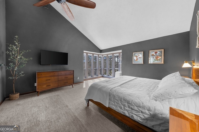 carpeted bedroom with a ceiling fan, baseboards, and high vaulted ceiling