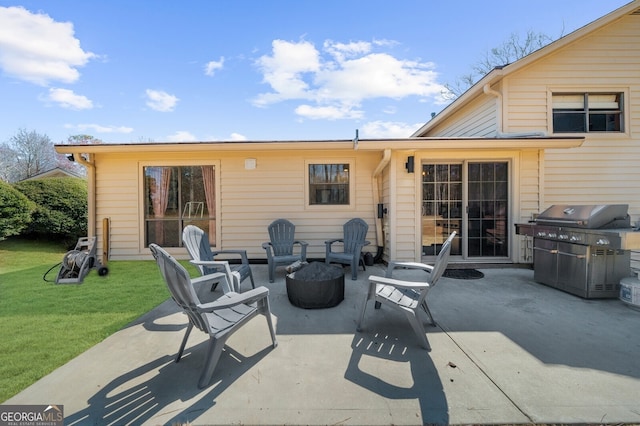 view of patio with a fire pit and area for grilling