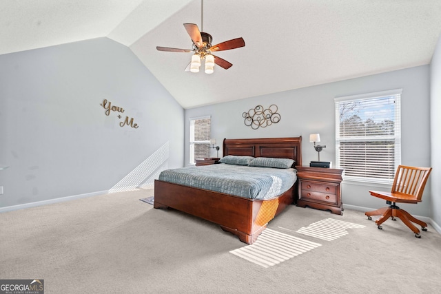 carpeted bedroom featuring baseboards, ceiling fan, and vaulted ceiling