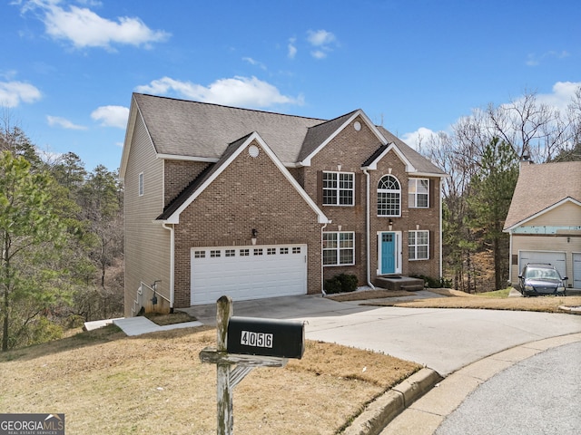 view of front of home featuring brick siding, concrete driveway, and an attached garage