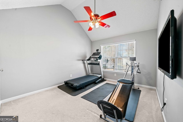 workout area with vaulted ceiling, carpet, baseboards, and ceiling fan