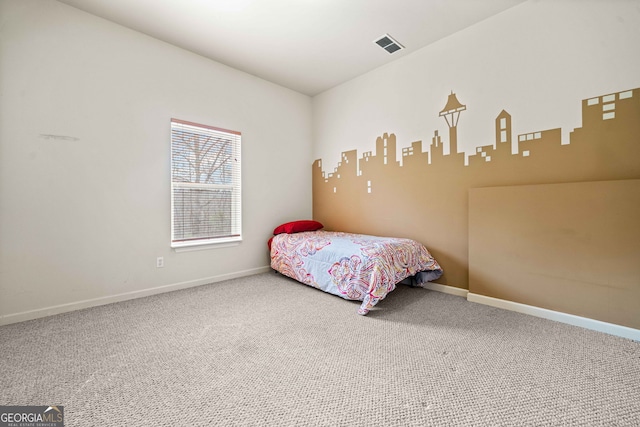 bedroom with baseboards, carpet floors, and visible vents