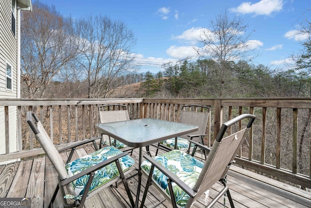 wooden deck with outdoor dining space