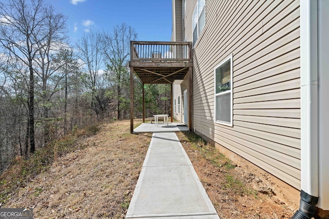 view of yard with a balcony