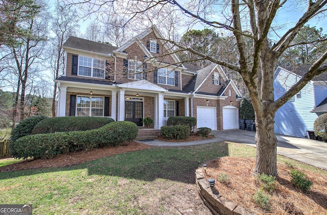 view of front of home with concrete driveway, an attached garage, french doors, and brick siding