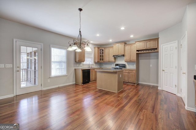 kitchen with dark wood finished floors, black appliances, a chandelier, and a kitchen island