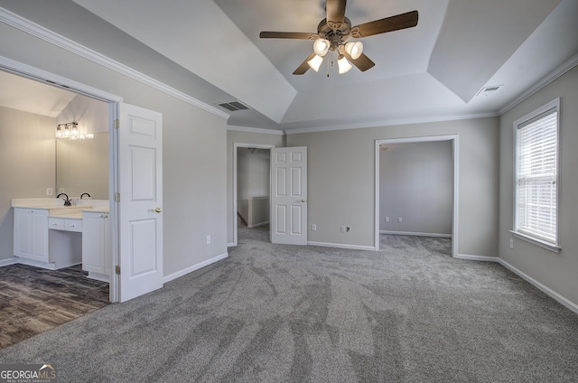 unfurnished bedroom featuring baseboards, visible vents, and dark carpet