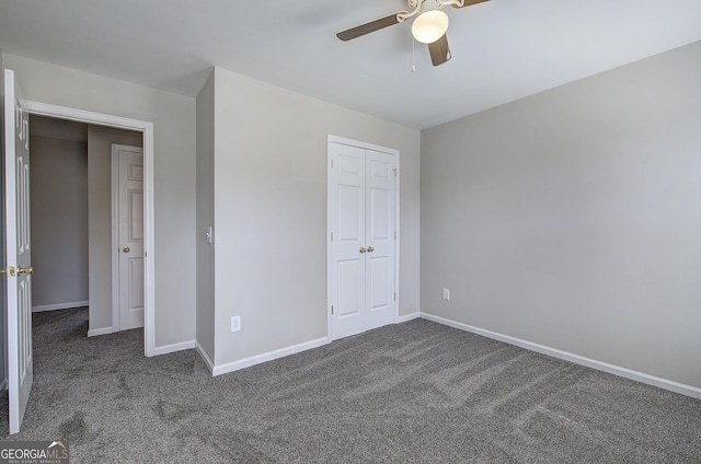 unfurnished bedroom with carpet flooring, a ceiling fan, baseboards, and a closet