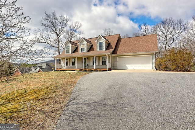 95 Volunteer Ln, Murphy, NC 28906 - cape cod home featuring asphalt driveway, covered porch, a garage, and a shingled roof