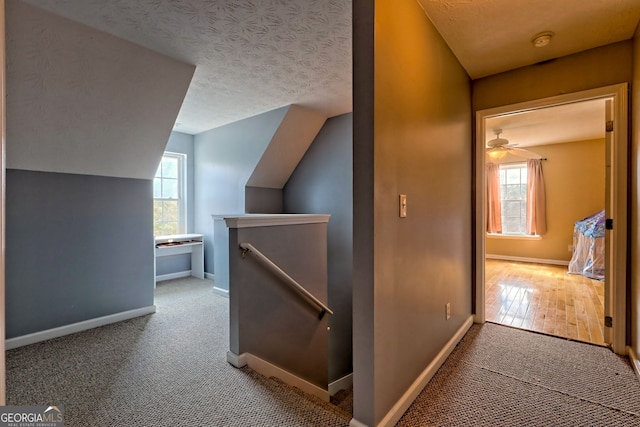 95 Volunteer Ln, Murphy, NC 28906 - hall featuring an upstairs landing, carpet flooring, a textured ceiling, and vaulted ceiling