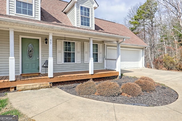 95 Volunteer Ln, Murphy, NC 28906 - cape cod-style house with driveway, roof with shingles, a porch, and an attached garage