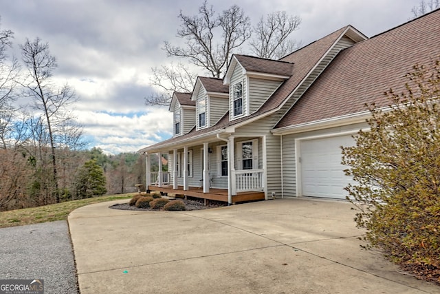95 Volunteer Ln, Murphy, NC 28906 - view of property exterior with covered porch, concrete driveway, an attached garage, and a shingled roof