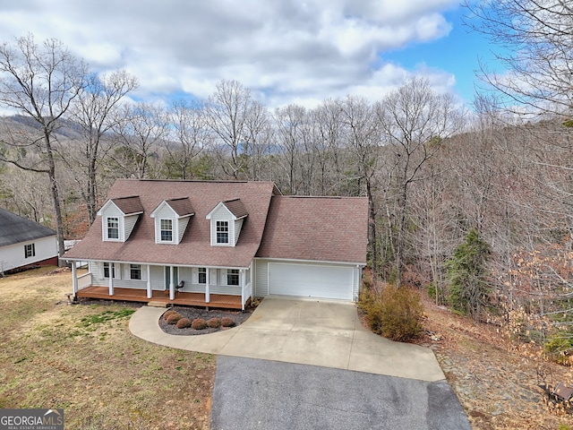 95 Volunteer Ln, Murphy, NC 28906 - new england style home with a front yard, driveway, roof with shingles, a porch, and a garage