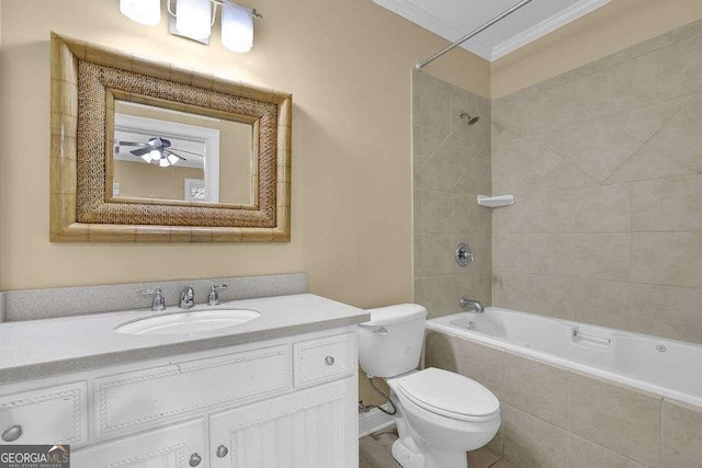 full bath featuring vanity, toilet, tiled shower / bath, and ornamental molding