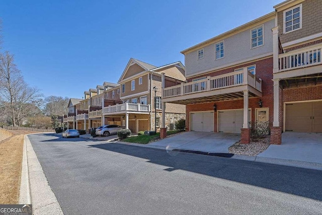 view of street featuring curbs and a residential view