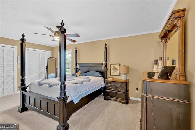 25 Wesley Trce SE, Cartersville, GA 30120 - bedroom featuring light colored carpet, two closets, baseboards, and ornamental molding