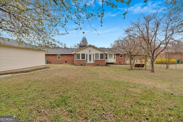 25 Wesley Trce SE, Cartersville, GA 30120 - rear view of property featuring crawl space, brick siding, a chimney, and a lawn