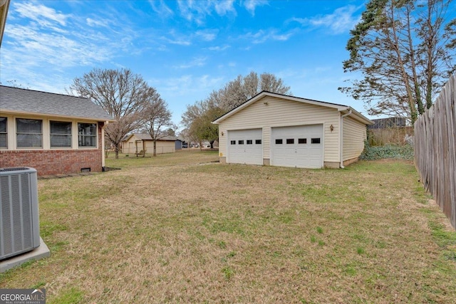 25 Wesley Trce SE, Cartersville, GA 30120 - view of yard featuring an outdoor structure, fence, a garage, and central AC