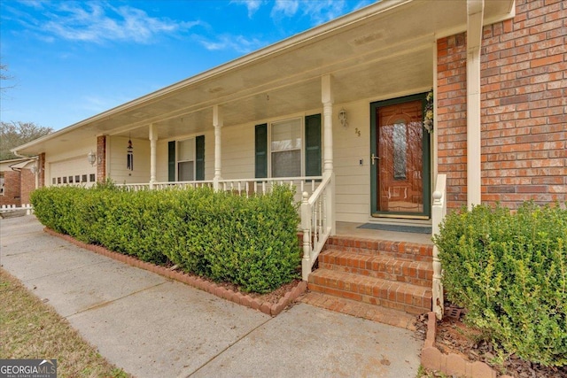25 Wesley Trce SE, Cartersville, GA 30120 - entrance to property with brick siding, a porch, and an attached garage