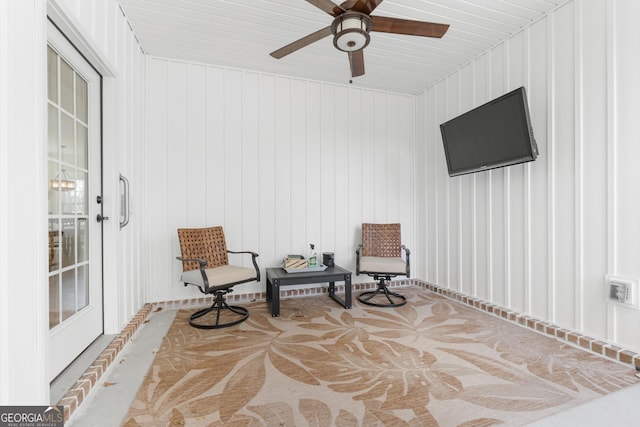 sitting room with a ceiling fan and visible vents