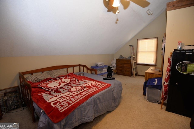 bedroom featuring carpet flooring, ceiling fan, and vaulted ceiling