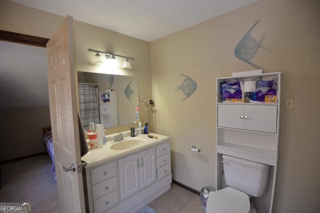 full bathroom featuring tile patterned floors, toilet, a textured ceiling, baseboards, and vanity