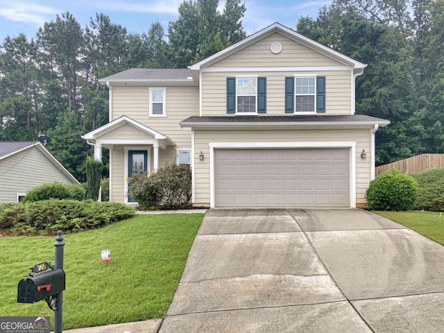 traditional-style house with a front lawn, concrete driveway, fence, and a garage